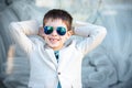 Little boy in a nice suit and glasses. Back to Royalty Free Stock Photo