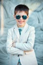 Little boy in a nice suit and glasses. Back to Royalty Free Stock Photo