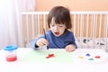 Little boy painting with brush and gouache Royalty Free Stock Photo