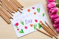 Little boy paints greeting card for Mom on Mother`s Day with the inscription `Happy mother`s day`