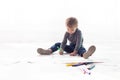 Little boy paints a picture of crayons Royalty Free Stock Photo