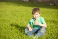 Little boy in park eating ice cream Royalty Free Stock Photo