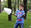 Little boy in the park. Eats cotton candy.