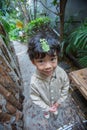 Little boy with Phyllium bioculatum on his head Royalty Free Stock Photo