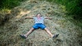 a little boy on a pile of dry hay