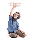 Little boy with pilot hat and toy airplane Royalty Free Stock Photo