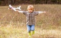 Little boy with plane. Little kid dreams of being a pilot. Child playing with toy airplane. Happy child playing Royalty Free Stock Photo