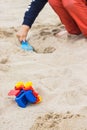 Little boy with children toys on sand at beach. Relax or playing in summer. Vacation time Royalty Free Stock Photo