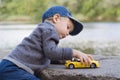Little boy play with a car