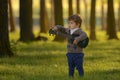 Little Boy Play Guitar in Forest Royalty Free Stock Photo