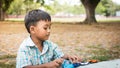 little boy play toy car in the green park Royalty Free Stock Photo