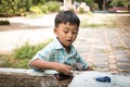 little boy play toy car in the green park Royalty Free Stock Photo