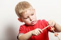 Little boy play with toy wooden screwdriver. Royalty Free Stock Photo