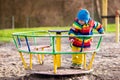 Little boy on playground in autumn Royalty Free Stock Photo