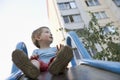 Little Boy On The Playground Slide Royalty Free Stock Photo