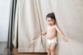 Cheerful and playful little toddler wearing only diaper at his home Royalty Free Stock Photo