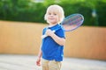 Little boy playing badminton on the playground Royalty Free Stock Photo