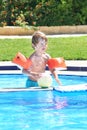 Little boy playing with a ball in a swimming pool Royalty Free Stock Photo