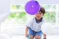 Boy playing balloons in birthday party Royalty Free Stock Photo