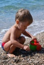 Little boy playing on the beach Royalty Free Stock Photo