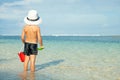 Little boy playing on the beach at the day time