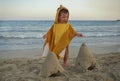 Little boy playing on beach and making sand castles Royalty Free Stock Photo