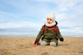 Little boy playing on beach in winter Royalty Free Stock Photo