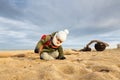 Little boy playing on beach in winter Royalty Free Stock Photo