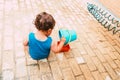 Little boy playing with bucket and water at home confinement covid19 Royalty Free Stock Photo