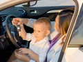 Little boy playing with a a car key