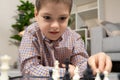 Little boy playing chess. Board games for children Royalty Free Stock Photo