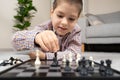 Little boy playing chess. Board games for children Royalty Free Stock Photo