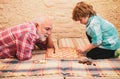 Little boy playing chess with his Grandfather. Chess hobbies - granddad with grandson on a playing chess. Royalty Free Stock Photo