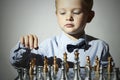 Little boy playing chess.Smart kid.genius Child. Intelligent game.Chessboard Royalty Free Stock Photo