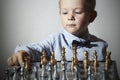 Little boy playing chess.Smart kid.Little genius Child. Intelligent gam
