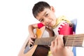 Little boy playing classic guitar course on white background