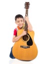 Little boy playing classic guitar course on white background Royalty Free Stock Photo