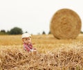 Little boy playing in a cowboy hat on the nature Royalty Free Stock Photo