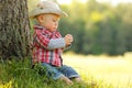 Little boy playing cowboy in nature Royalty Free Stock Photo