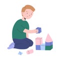 Little boy playing with cubes, toddler boys building a tower with wooden bricks, kindergarten activities, cute modern