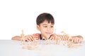 Little boy playing dinosaur fossil toy on the table indoor activities Royalty Free Stock Photo