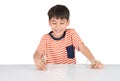 Little boy playing dinosaur fossil toy on the table indoor activities Royalty Free Stock Photo