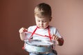 Little boy playing the drum. Child development concept. Royalty Free Stock Photo