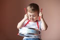 Little boy playing the drum. Child development concept. Royalty Free Stock Photo