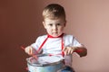 Little boy playing the drum. Child development concept. Royalty Free Stock Photo