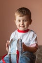 Little boy playing the drum. Child development concept Royalty Free Stock Photo
