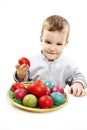 Little boy playing with easter eggs in basket Royalty Free Stock Photo