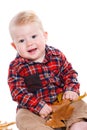 Little boy playing on the floor with maple leaves. Royalty Free Stock Photo