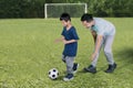 Little boy playing football with his father Royalty Free Stock Photo