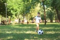 Little boy playing football in park Royalty Free Stock Photo